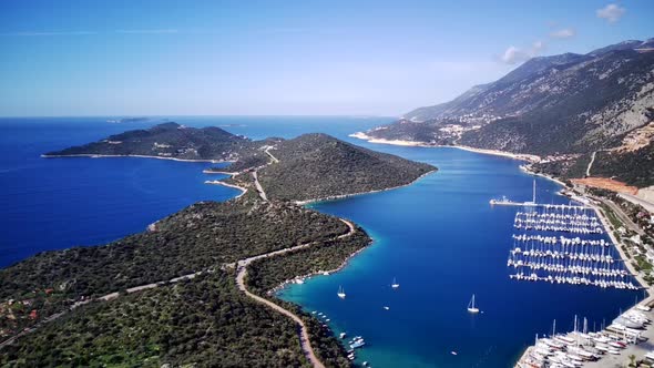 The top view from the drone of Kas resorts, bay with yahts and city in Mugla province of Turkey