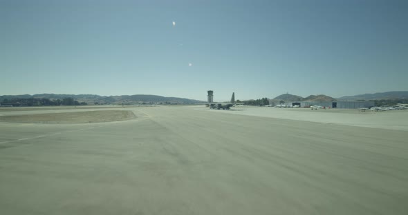 Aerial helicopter wide shot, push past snowy mountain peak, drone footage alt
