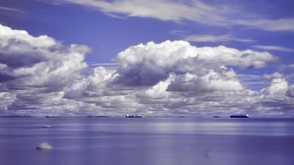 Long Exposure Infrared Timelapse of Sea with Ships and Changing Summer Clouds
