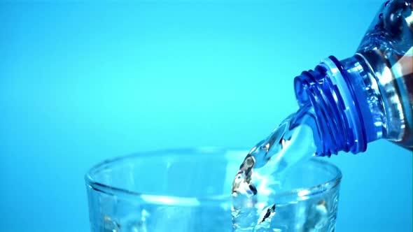 Super Slow Motion Water Pours From Bottle to Glass alt