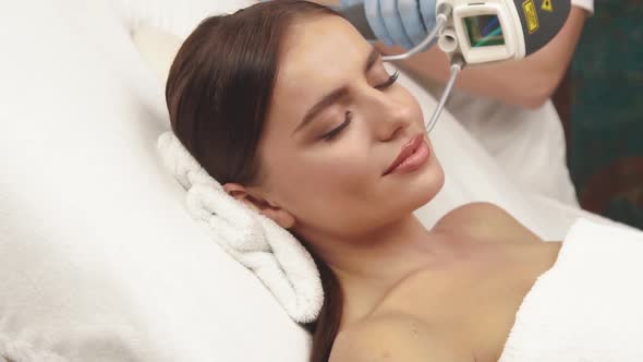 Happy Woman with Perfect Skin Having Erbium Laser Theraphy alt