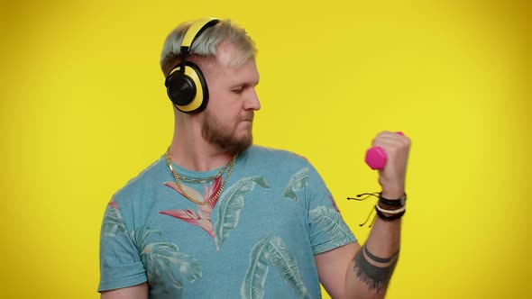 Sporty Tourist Adult Man Listening Music Via Headphones Working Out Pumping Up Lifting Dumbbells alt