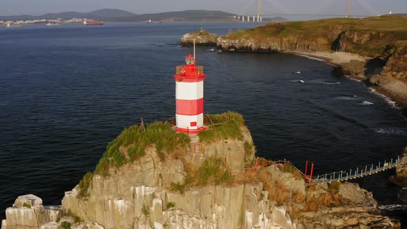 Drone View of the Picturesque Old Basargin Lighthouse on the Coast of the Sea alt