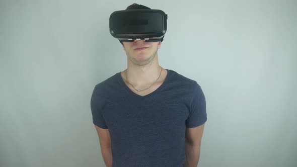 Man In A Modern Helmet Of Virtual Reality Speaks To The Camera