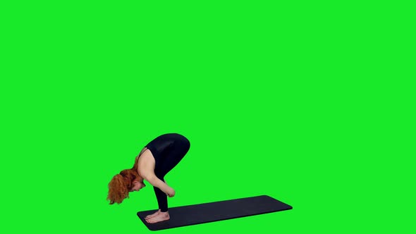 Athletic Woman in Black Bodysuit Doing Yoga Exercises on Green Screen