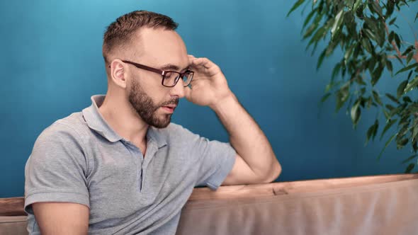 Unwell Male in Glasses Massaging Template Feeling Headache alt