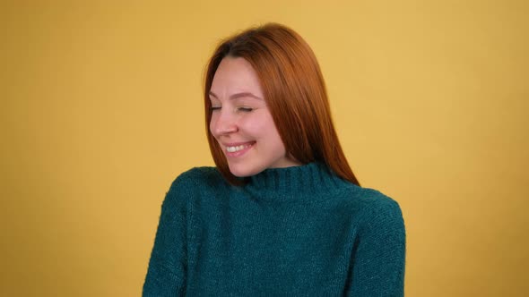 Young Red Hair Woman Posing Isolated on Yellow Color Background Studio alt