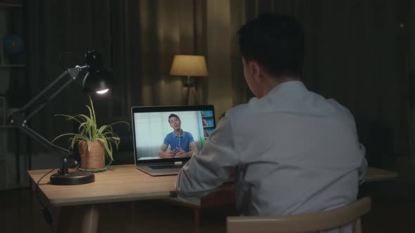Man Using Laptop Talk To Colleagues In Video Call Meeting, Working From House alt