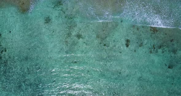 Tropical aerial copy space shot of a white paradise beach and aqua turquoise water background in hi  alt