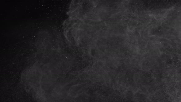 Super Slow Motion Shot of Atmospheric Particle Background Isolated on Black at 1000 Fps alt