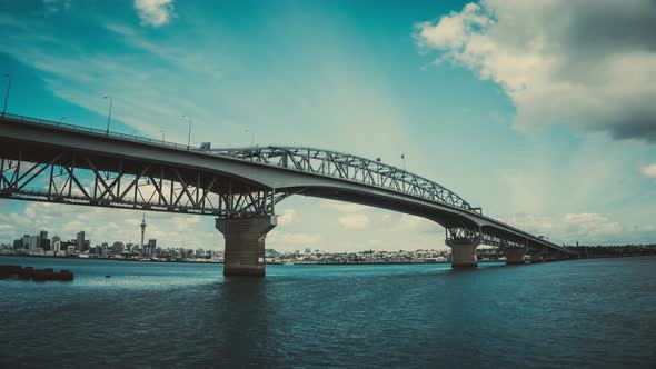 Time Lapse Auckland Harbour Bridge Reflecting on Westhaven Marina in Auckland alt
