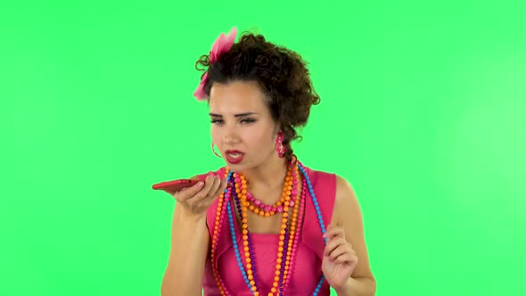 Girl Asks for Information on the Network Via Phone on Green Screen alt