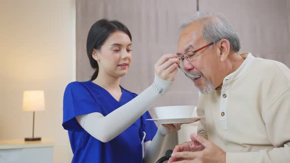 Therapist doctor or nurse at nursing home feeding food to disabled senior elderly man on wheelchair. alt