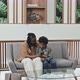 Mom and Son Using Smartphone in Waiting Room - VideoHive Item for Sale
