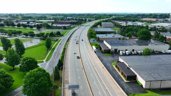 Drone view of cars traveling on large highway. Road system in America funded by tax payer dollars. C alt