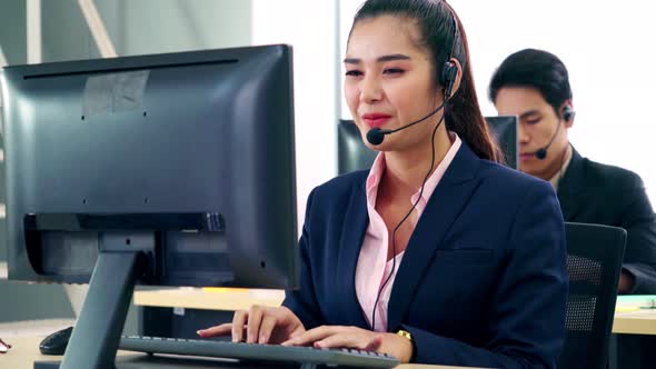 Business People Wearing Headset Working in Office alt