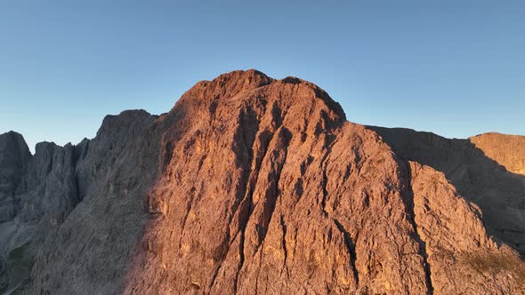 Dolomites mountains peaks on a summer sunrise alt