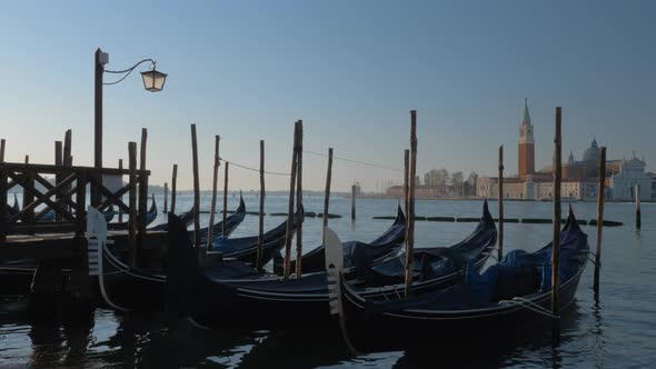 Gondola Boats with a Church in the Background alt