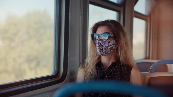 Woman In Transport Train In Protective Mask Sars COVID19 Virus.Pandemic Coronavirus Covid-19 Outdoor alt