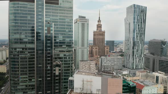 Aerial view of downtown Warsaw, Rondo 1 skyscraper, and Palace of culture and science from the side alt