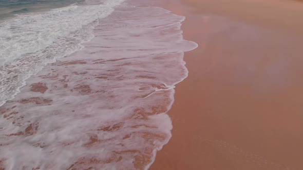 Aerial tilt up shot Empty beach shoreline on Cloudy day, Porto Santo alt