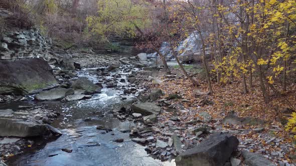 Magnificent drone recording of a large waterfall in the middle of the forest. alt