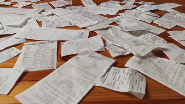 Cash Register Receipts On A Wooden Table