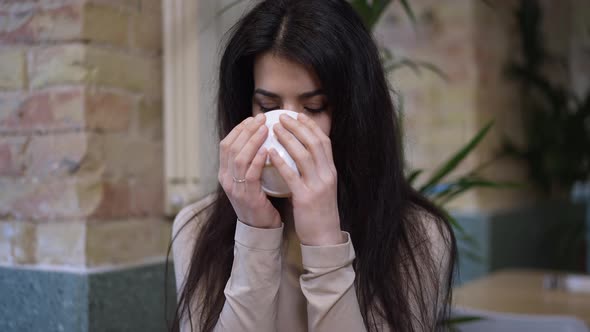 Closeup Middle Eastern Woman Drinking Tasty Tea Looking at Camera Smiling alt