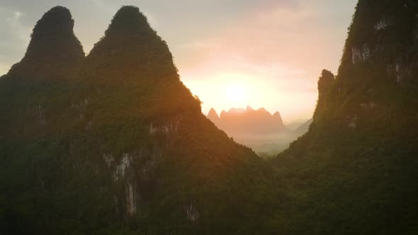 Aerial of the amazing rock formations along the Li River in China alt