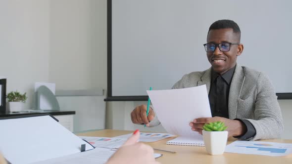 African Black Man Shake Hands with His Business Partner Caucasian Woman