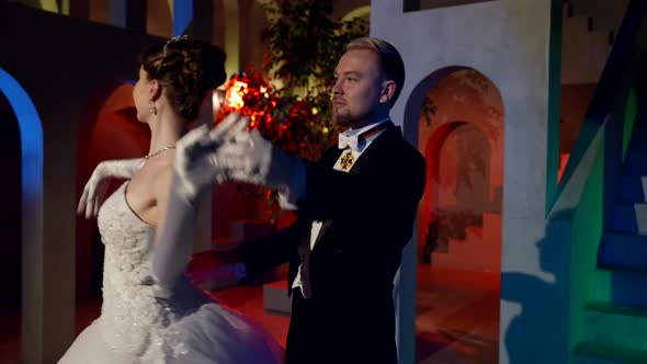 A Fantastic Beauty Smiles While Spinning a Fluttering Vintage Dress alt