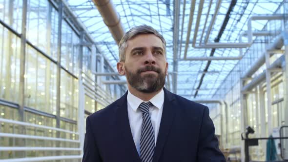 Buildings Video Footage - A Man Walking Inside A Production Plant alt