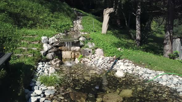 Pond and creek in landscape, Alta Badia, Italy