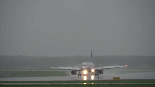Aeroflot plane landing at the airport on rainy day alt