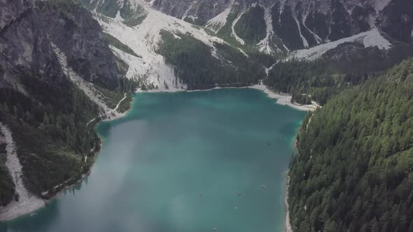 Aerial view of lake Braies lago di Braies in Dolomites mountains European Alps forest hillside Italy alt
