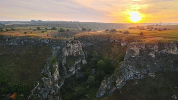 Aerial drone view of the Duruitoarea natural reservation at sunset in Moldova. The Gorge, village alt