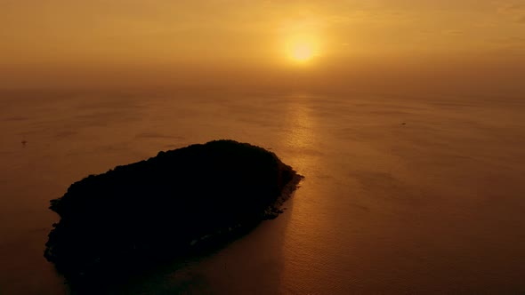 Beautiful bright orange sunset over the Andaman Sea. Aerial. Drone alt