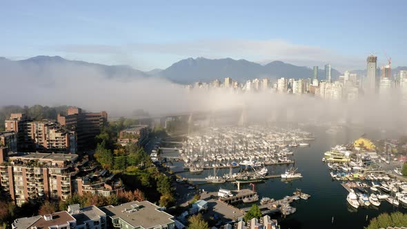 Aerial rise over False Creek in scenic Vancouver, British Columbia. alt
