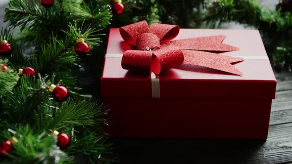 Christmas Present Near Conifer Branches with Beads alt