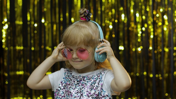 Child Dances, Listens Music on Headphones. Little Kid Girl Dancing, Having Hun, Relaxing, Enjoying alt