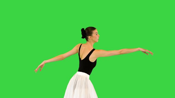 Young Ballerina Runs Slowly Making Arms Movements on a Green Screen Chroma Key