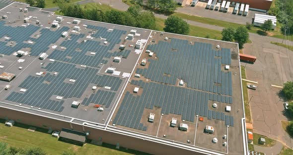 Aerial Panoramic Overview of Solar System on a Roof Building Warehouse alt
