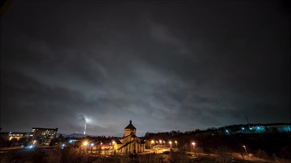 Beautiful time lapse: massive clouds floating night city sky. 