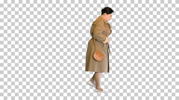 Thick brunette woman in a trench coat walking, Alpha Channel alt