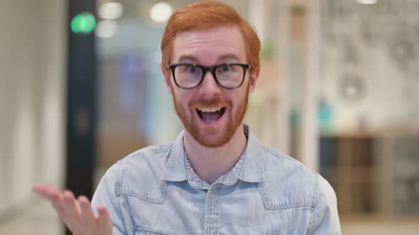 Portrait of Beautiful Casual Redhead Man Doing Video Chat alt