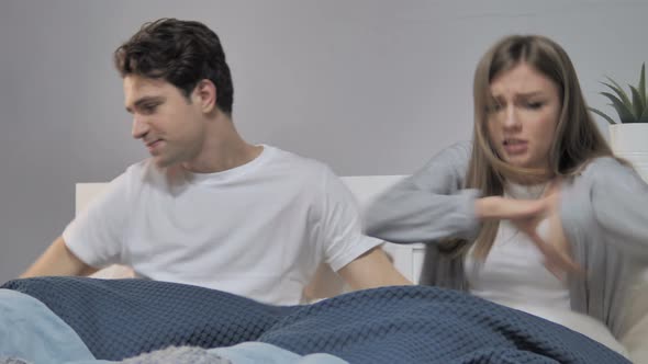 Problem in Relationship, Unhappy Young Couple Arguing in Bed alt