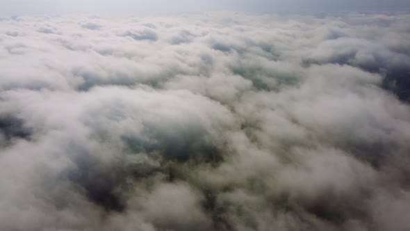 Aerial Perspective View of Flying Over Clouds alt
