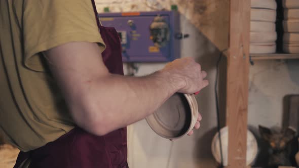 Sorting Plates Inside a Ceramic Oven on Craft Factory Potter Shop alt