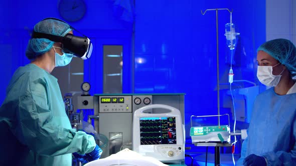 Doctors in VR Glasses Performing Surgery in Hospital