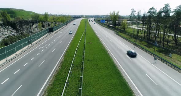 Aerial view of a multiple lane highway, camera in the middle of the road. alt
